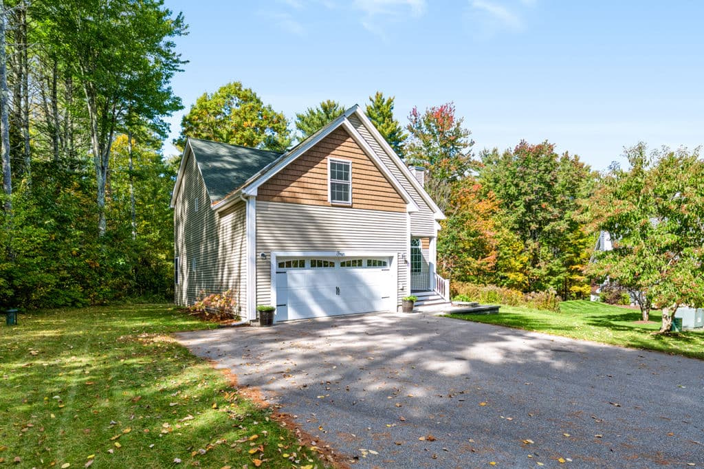 The home from the paved driveway