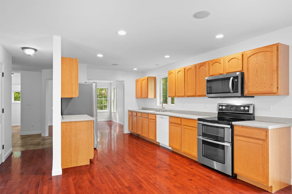 Kitchen with stainless steel appliances and hardwood floors